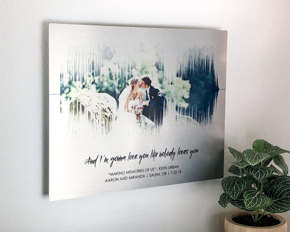 10 year anniversary gift. A photo of a couple is positioned inside the soundwave of a wedding song. It is printed on brushed aluminum and tin panel. Customized with any song and personalized with a lyric and personal text (names, location, date).